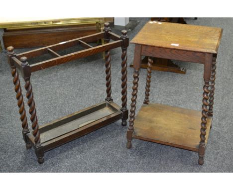 An early 20th century oak stick stand, barley twist supports, c.1910; a conforming oak hall table (2) 