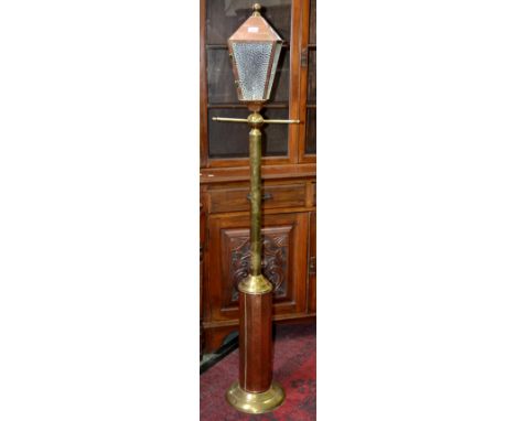 A reproduction brass and copper standard lamp fashioned as a street lamp.