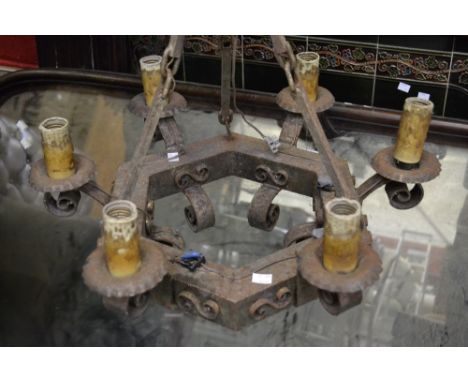 A Spanish six light iron chandelier
