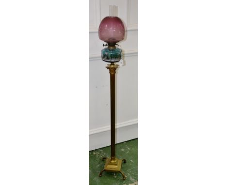 A Victorian oil lamp, brass column, Mary Gregory reservoir