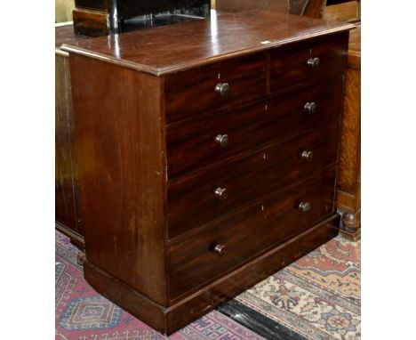 A Holland & Sons mahogany chest, moulded top, two short drawers over three graduated long, button handles, plinth base.