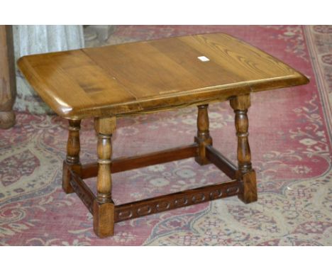 A small light oak drop leaf coffee table 