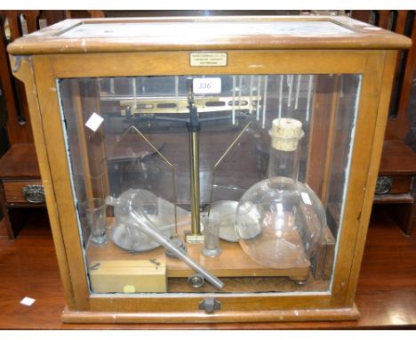 Scientific Instruments - a set of laboratory balance scales, glass cased; weights, boxed; glass flasks, measuring jugs, etc