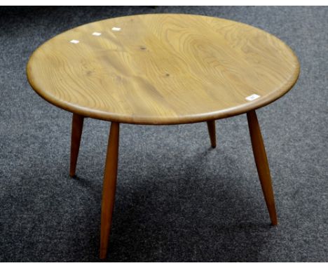 An Ercol style circular coffee table 