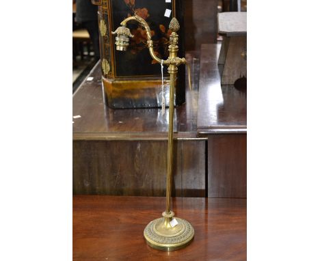 A Georgian style gilt metal table lamp, reeded column, circular socle. (Wired for electricity)