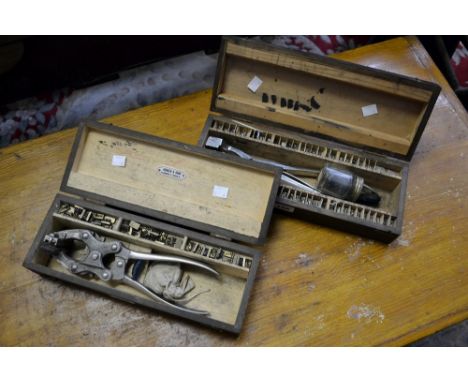 Agriculture - a button machine for marking livestock's ears, cased; another similar (2)