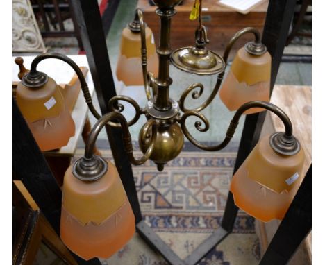 An Art Deco style five branch electric ceiling light with tapering drop bar supporting five scroll arms each terminating in o