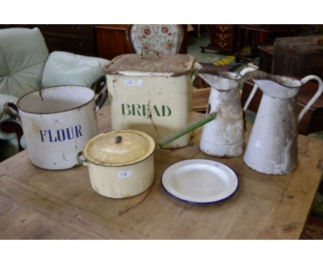 An enamel bread bin and cover; others including flour bin, saucepan and cover, water jugs, bucket, etc