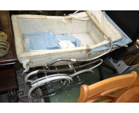 A vintage Wilson Pastorale pram with hood and tonneau, circa 1960. Made by Silver Cross and named after William Wilson, the f