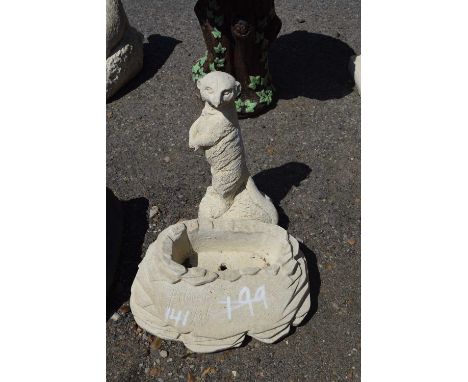 Two small composite garden statues, one of a meerkat, the other a planter, height approx 30cm