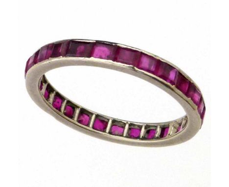 Unmarked platinum and ruby eternity ring, circa 1930, ring size Q, gross weight 2.8g.