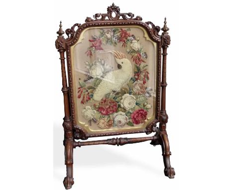 Victorian mahogany cheval firescreen, the carved frame enclosing a stump work cockatoo, height 125cm.