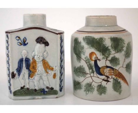 Two Prattware tea canisters circa 1800, one with moulded figures, both painted in Pratt colours one with a bird in branches i