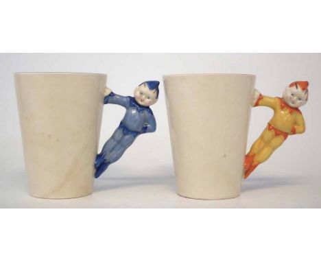 Two Clarice Cliff Gnome ware beakers, with pixie handles, printed marks to base, (2) 9cm high     Condition report: Wear to t