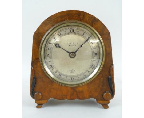 An Elliott mantel clock, circa 1950, in domed walnut veneered case, circular silvered dial, signed Pearce &amp; Sons Limited,