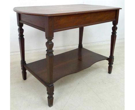 A late Victorian mahogany side table, moulded edge over a plain frieze, raised on square section legs with a shaped lower tie