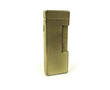 A collection lighters including a gold plated Dunhill lighter, the body with engine turned diamond detailing, the base marked