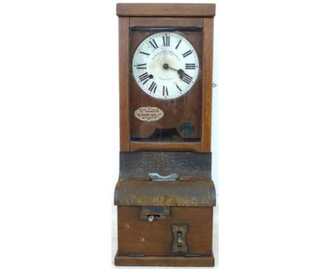 An early 20th century oak cased Time Recorder Supply &amp; Maintenance Co, 159 Grange Road, London SE1, clocking in machine, 