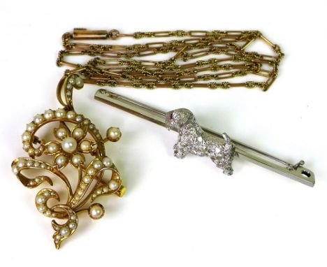 An Edwardian 18ct white gold bar brooch, set with a Scottie Dog, diamond set body and ruby eye, 5.2g, together with a 15ct go