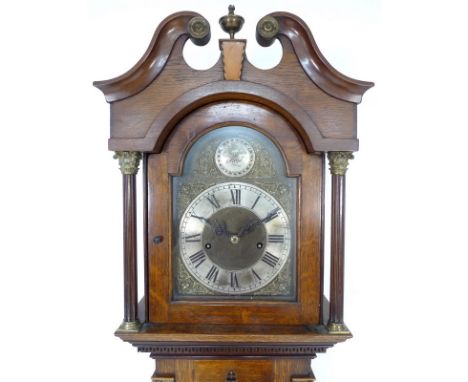 An oak long case clock, of narrow proportions, with parts 19th century and later, the hood with fluted quarter columns and br