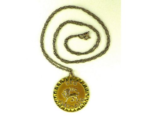 A 9ct gold pendant and chain, the pendant depicting the astrological sign of Leo, 4.7g total. 