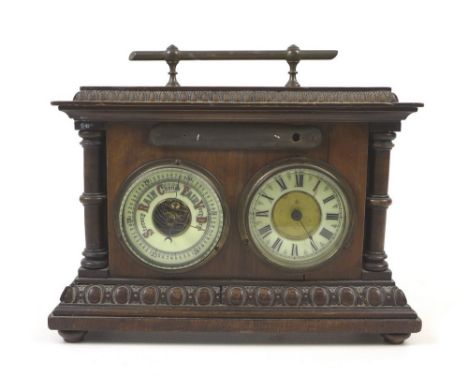 An Edwardian oak cased clock and barometer combined in a single case but lacking its thermometer, flanking pillars, egg and d