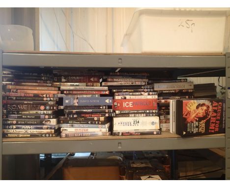 Shelf of mixed DVDs. This lot is not available for in-house P&amp;P. 