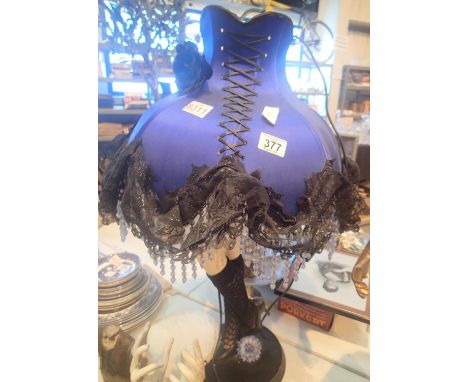 Large lamp in the form of a skirt with ladies legs base. This lot is not available for in-house P&P.Condition Report: All ele