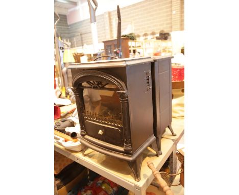 Two small electric log effect fires. This lot is not available for in-house P&P.Condition Report: All electrical items in thi