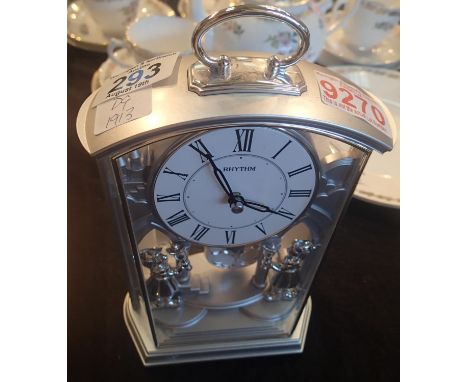 Rhythm decoration mantel clock with pendulum, working as new. This lot is not available for in-house P&amp;P. 