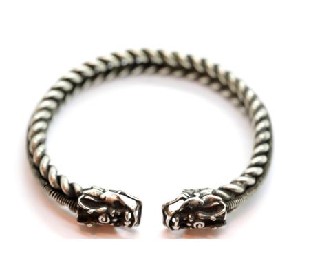 White metal Tibetan silver twisted rope effect bangle with dragon finials. P&amp;P Group 1 (£14+VAT for the first lot and £1+