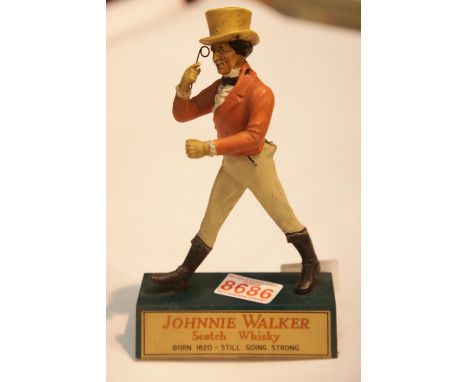 Vintage cast plastic original Johnnie Walker scotch whisky advertising figurine, lacking cane. H: 20 cm 12 cm across base P&a