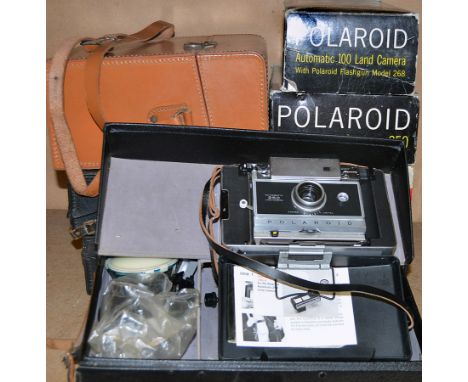 5 Boxed Polaroid Land Cameras & 4 Others. Some with Cases.W