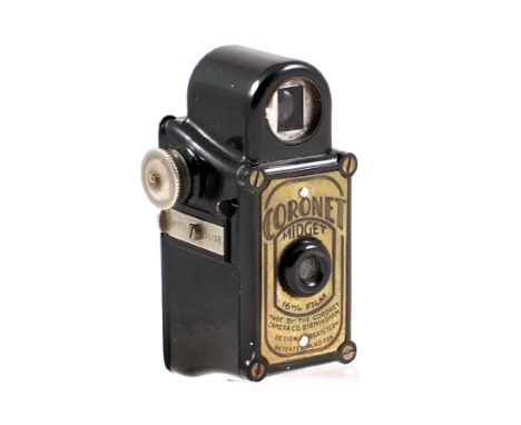 Black Coronet Midget Sub-miniature Camera. Tiny chip to top of rear door (condition 4F) with film spool.