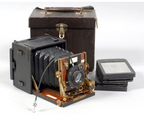 A Sanderson Junior Model Plate Camera. With Carl Zeiss Jena 13.5cm f4.5 lens in a Compur shutter, 4 dark slides and case.