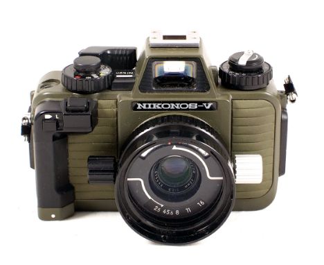 Nikonos-V Underwater Camera #2106770 with Nikkor 35mm f2.5 lens #399249 (condition 5E) and hood. Uncommon in this green colou