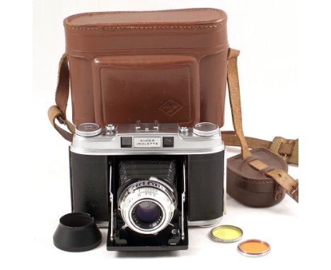 Agfa Super Isolette Folding CRF Roll Film Camera. #UJ1298 With Solinar 75mm f3.5 lens. (condition 5F). With case & hood.