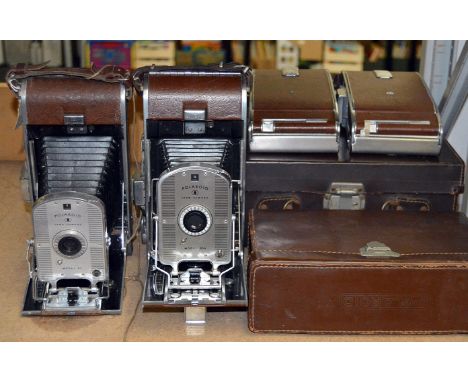7 Polaroid 95, 95A etc Land Cameras, with Original Cases. The first Polaroid models from the 1950s.W