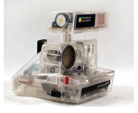A Rare Transparent Polaroid AF660 Instant Print Camera. In working order. Probably produced as a dealer demonstration model.