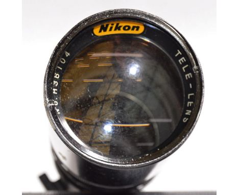 An un-named Manual Focus 600mm f8 Prime Reflex Lens #H36104, Nikon Fit. Pre-set diaphragm, several internal cleaning marks. (