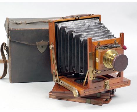 An Un-Named English Wood & Brass Half Plate Camera. With brass lens in working Thornton Pickard shutter.