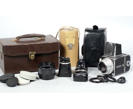 A Hasselblad 500C Camera Outfit. Comprising 500C body #TU74684 (condition 5F) with 120 film back & Carl Zeiss Planar 80mm f2.