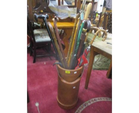 Mixed walking sticks, umbrellas and shooting stick, together with a leather stick stand 