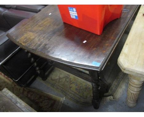 An Edwardian pine dining table standing on four fluted legs with a 1930s barley twist, gateleg table, a stick stand, a mirror