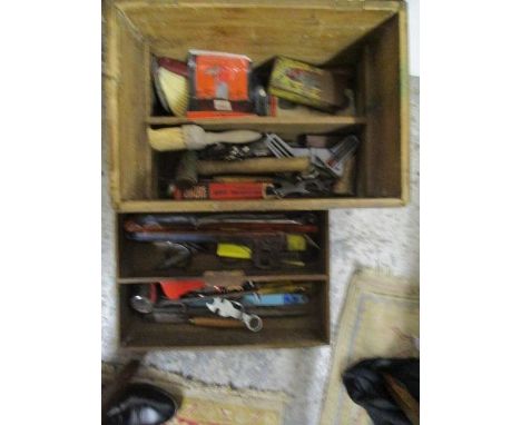 A wooden tool box containing vintage tools including an Elora drop forged 18" monkey wrench 