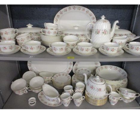 A Minton Spring Bouquet dinner, tea and coffee service having white ground and pink floral rose border, to include three ture