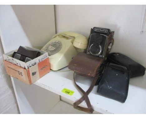A mixed lot to include a vintage telephone, a Skymatic camera, a View Master and two other cameras 