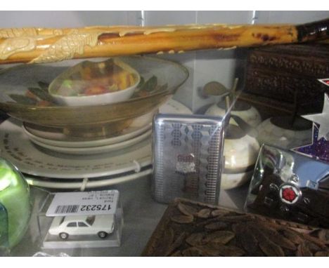 A mixed lot to include paperweights, walking sticks and a cigarette case 