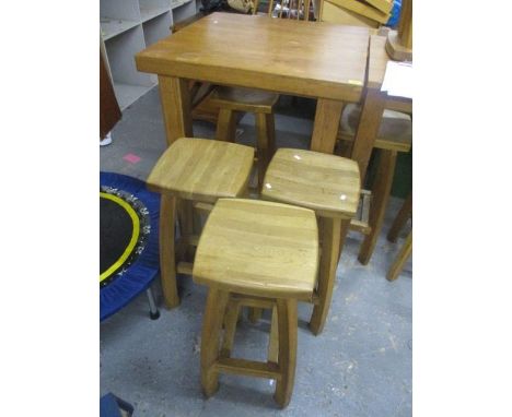 A modern light oak table 40"h x 31 1/2"w and four stools 