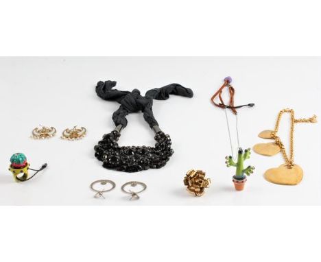 A collection of jewellery, to include a chain with three heart shaped pendants of various size stamped 'YVES SAINT LAUREN' on